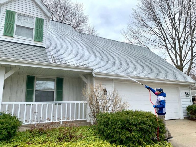 Softwashing an asphalt shingle roof in Cedarburg.