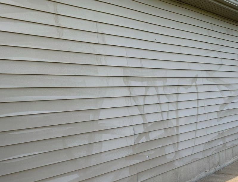 Picture of oxidation on house which can happen on all types of siding.